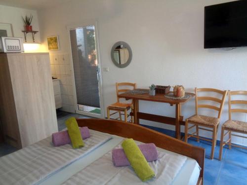 Postel nebo postele na pokoji v ubytování Apartments Moreta