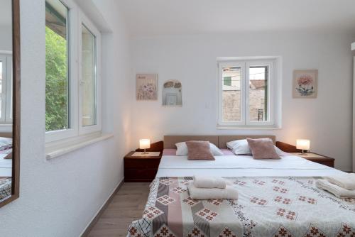 Giường trong phòng chung tại Filomena Rooms