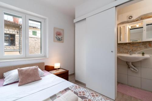 Postel nebo postele na pokoji v ubytování Filomena Rooms