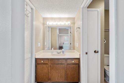 a bathroom with a sink and a mirror at Arcadian Dunes 312 in Myrtle Beach