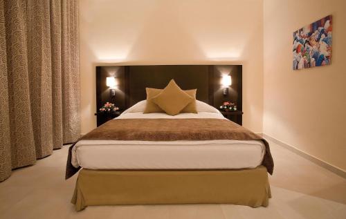 a bedroom with a large bed in a room at Labranda Targa Aqua Parc in Marrakech