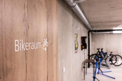 a room with bikes parked on a wall at Hotel Krone - Aktiv & Erholt in Churwalden