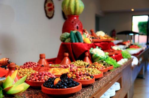 a buffet of fruits and vegetables on a table at Labranda Targa Aqua Parc in Marrakech
