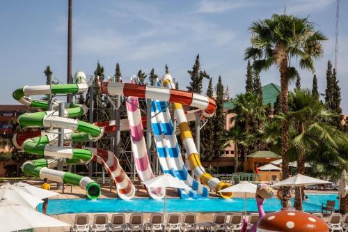a water slide in a swimming pool at Rose Aqua Park Hotel in Marrakesh
