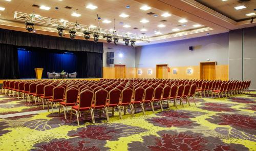 an auditorium with rows of chairs and a stage at Rose Aqua Park Hotel in Marrakesh