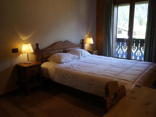 Кровать или кровати в номере Chalet Chamonix-Mont-Blanc, 3 pièces, 6 personnes - FR-1-507-32