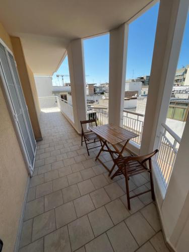 a balcony with a table and chairs on it at Residenza Martellotta in Bari