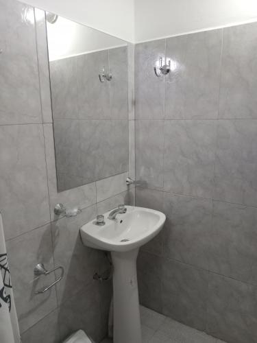 a bathroom with a sink and a shower at El Tonel in Cafayate