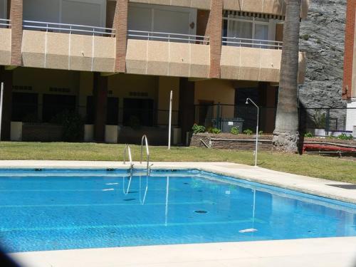 Bazén v ubytování Estupendo apartamento al mar nebo v jeho okolí