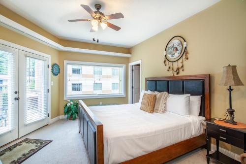 a bedroom with a bed and a ceiling fan at Skyline Sanctuary Wrap Around Deck in Gatlinburg