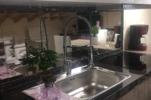 a kitchen sink with a faucet in a kitchen at 1 bedroom loft at Mytilene Port in Mytilini