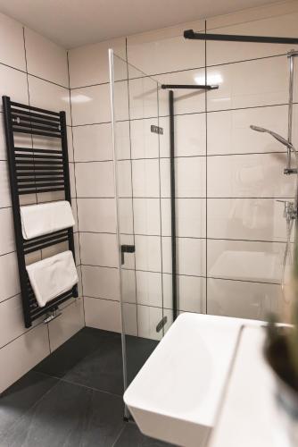 a bathroom with a glass shower and a sink at Apartmán Vlčice 211 Pec pod Sněžkou in Pec pod Sněžkou