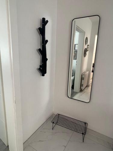 a mirror on a wall next to a room at Nice Apartment in Gmunden in Gmunden