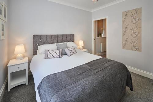 a bedroom with a large white bed and two lamps at Host & Stay - Brooklands Timeless in Scarborough