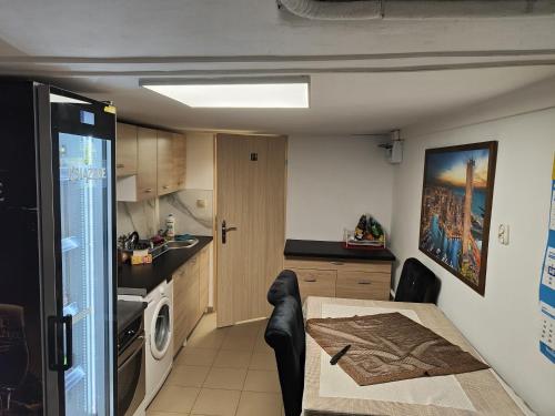 a kitchen with a table and a dining room at Mieszkanie Rampa in Iława