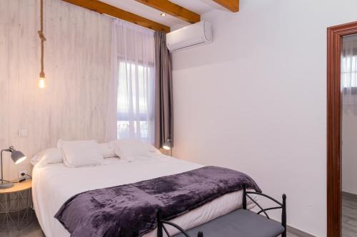a bedroom with a large bed and a window at Hotel SanMar in Cóbreces