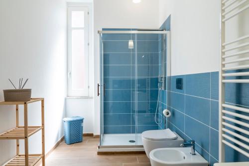 a bathroom with a shower and a toilet and a sink at Le Case di Franca in Trapani