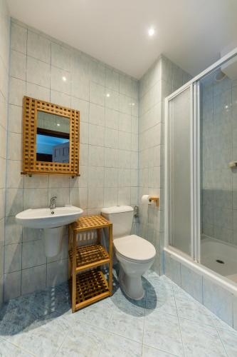 a bathroom with a toilet and a sink and a shower at Przystań Nemo in Ustka