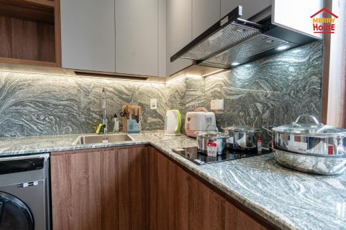 a kitchen with a sink and a counter top at Merry House Harmony in Ðông Khê