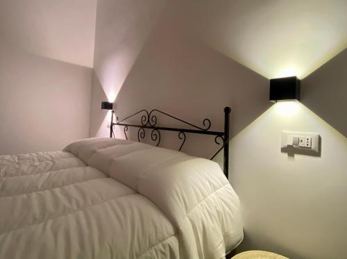 Postel nebo postele na pokoji v ubytování Pummarella b&b