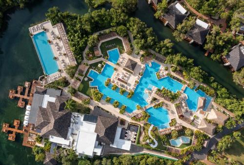 an aerial view of a resort with a pool at Fairmont Mayakoba in Playa del Carmen
