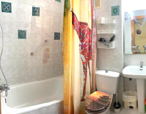 a bathroom with a shower and a toilet and a sink at ApartalMar in Torrevieja