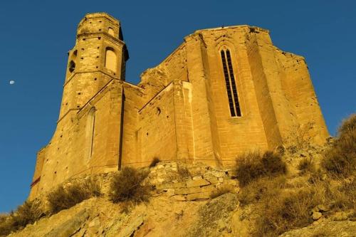 an old church sitting on top of a mountain at Cal Josep del Moto - Castelló de Farfanya in Castelló de Farfaña