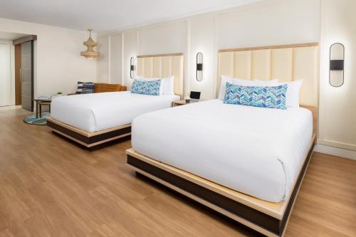 a hotel room with two beds in a room at The Anza-a Calabasas Hotel in Calabasas