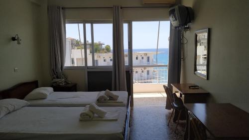 Postel nebo postele na pokoji v ubytování Poulea Rooms