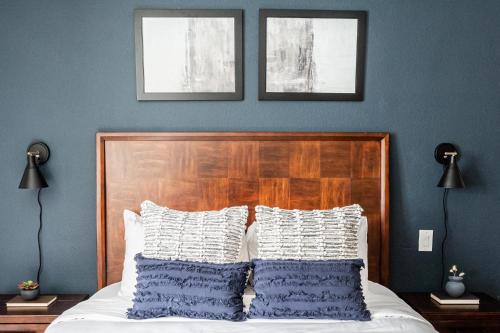 a bedroom with a bed with two pictures on the wall at Sleeps 2 - Free Parking - DTC Boston Commons in Greenwood Village
