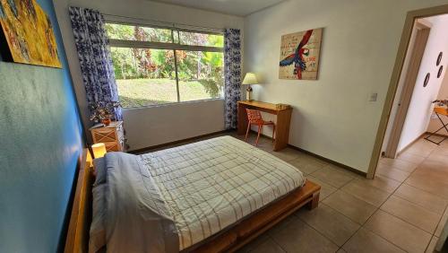 a bedroom with a bed and a window at Supercostarica in Grecia