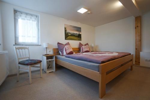 Ένα ή περισσότερα κρεβάτια σε δωμάτιο στο Rhöner Heim