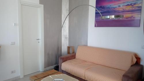 a living room with a couch and a table at Bed&breakfast Albysuite in Termoli