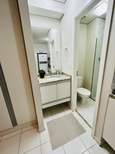 a bathroom with a sink and a toilet at Travellar Spot 912 in Ribeirão Preto