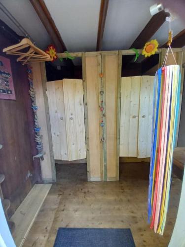 a room with wooden lockers on the wall in a room at Tan y coed's Rosemary Cabin in Conwy