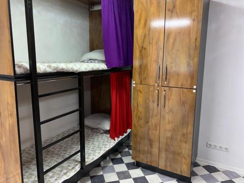 a room with two bunk beds and a closet at Hostel_petropavlovsk in Petropavlovsk