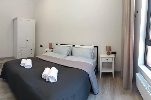 Postel nebo postele na pokoji v ubytování Saburtalo Palace appartments