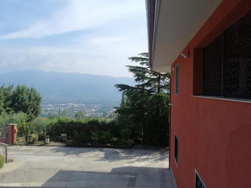 a view from the side of a red building at Villa Montemma in Montesarchio