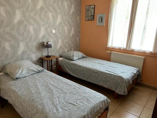 Posteľ alebo postele v izbe v ubytovaní Gite de la Sèvre