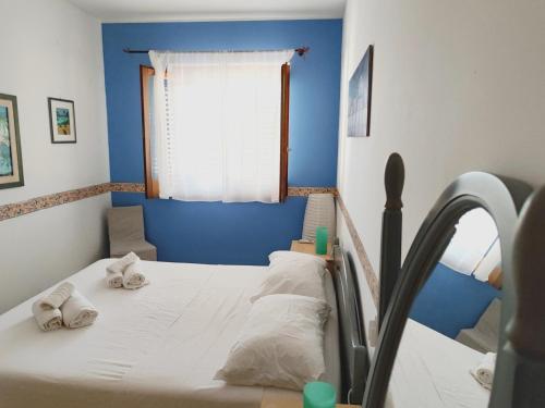 a hospital bed with towels on it in a room at Casa vacanze Lipari da Sergio spiaggia sotto casa in Lipari