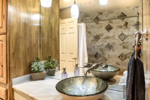 a bathroom with two sinks on a counter at Large Sedona Property with Private Pool! 7 Bedrooms! in Sedona
