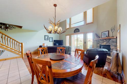 a living room with a table and a couch at San Juan Siesta in South Fork