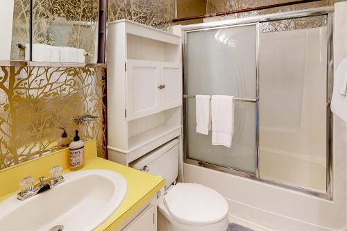 a bathroom with a sink and a toilet and a shower at Hemlock Nob B11 in Sugar Mountain