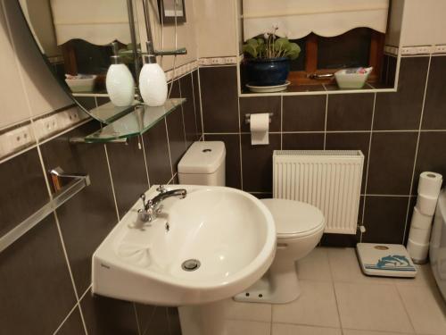 a bathroom with a sink and a toilet at House in Miltown Malbay