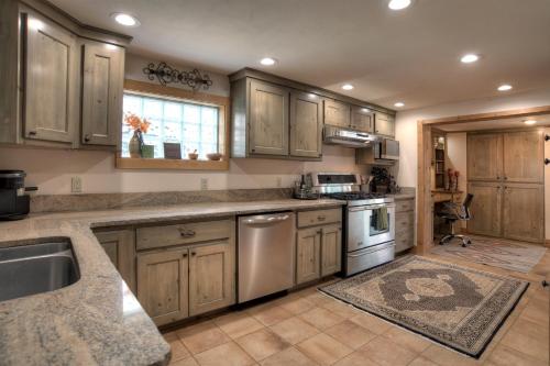 a kitchen with wooden cabinets and stainless steel appliances at Blessings in Creede