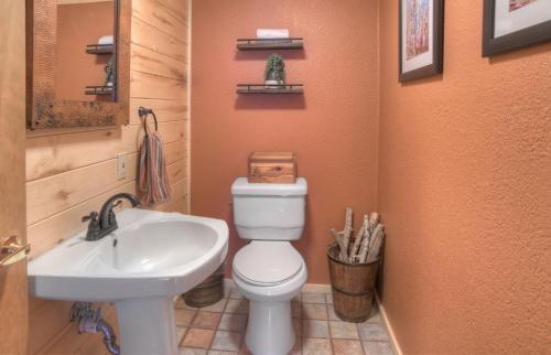 a bathroom with a toilet and a sink at Blessings in Creede