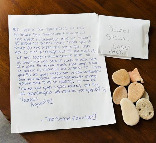 a page of a book with two cookies on a table at Private Heated Pool Oasis Pet-Friendly Retreat Short or long Stays Sleeps 2-8 Ppl in Pompano Beach