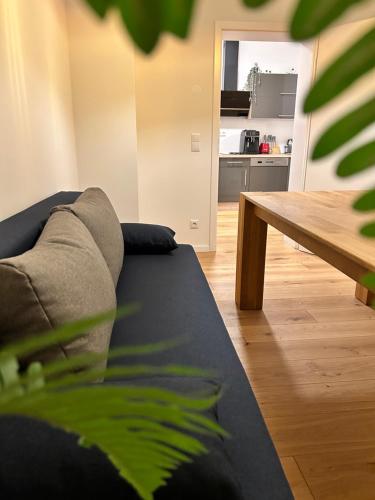 a living room with a couch and a table at Reeperbahn Apartments in Hamburg