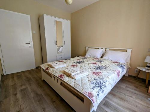 a bedroom with a bed with books on it at Nadalina Guest House in Kotor