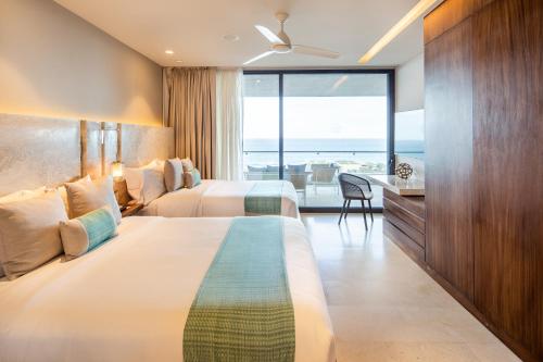 Ein Bett oder Betten in einem Zimmer der Unterkunft The Club at Solaz Luxury Villas